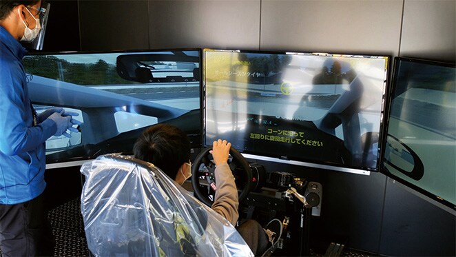 A participant using the driving simulator