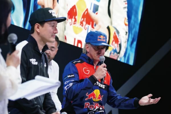 Spellbinding talk by our ambassador driver at TOKYO AUTO SALON 2025 (Left: Masato Kawabata / Right: Mad Mike)